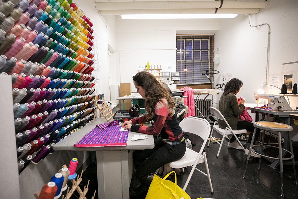Photo of students in textile studio.
