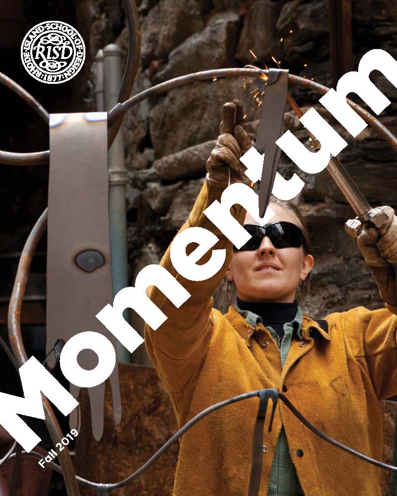 Cover of Momentum magazine; image of student welding