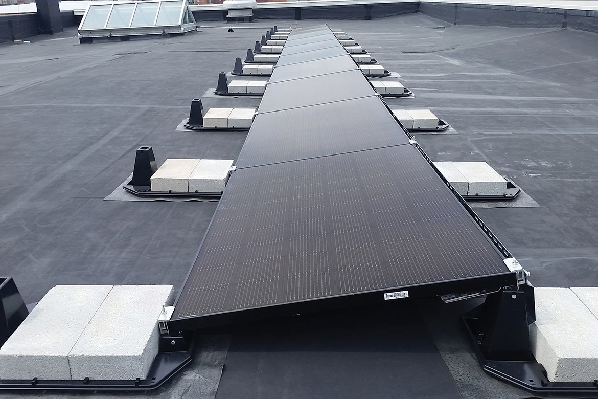 Photo of solar array on top of the What Cheer garage.