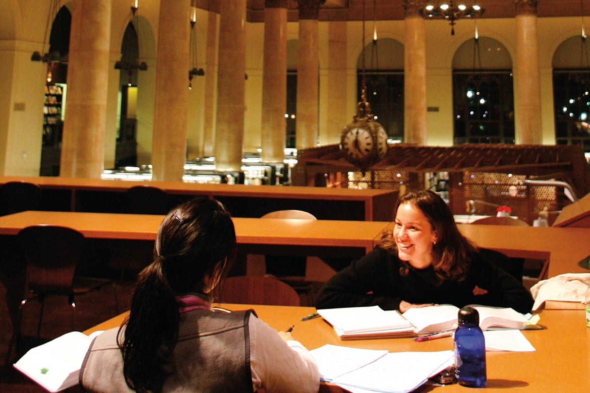 Photo of two students studying in the Fleet Library at RISD