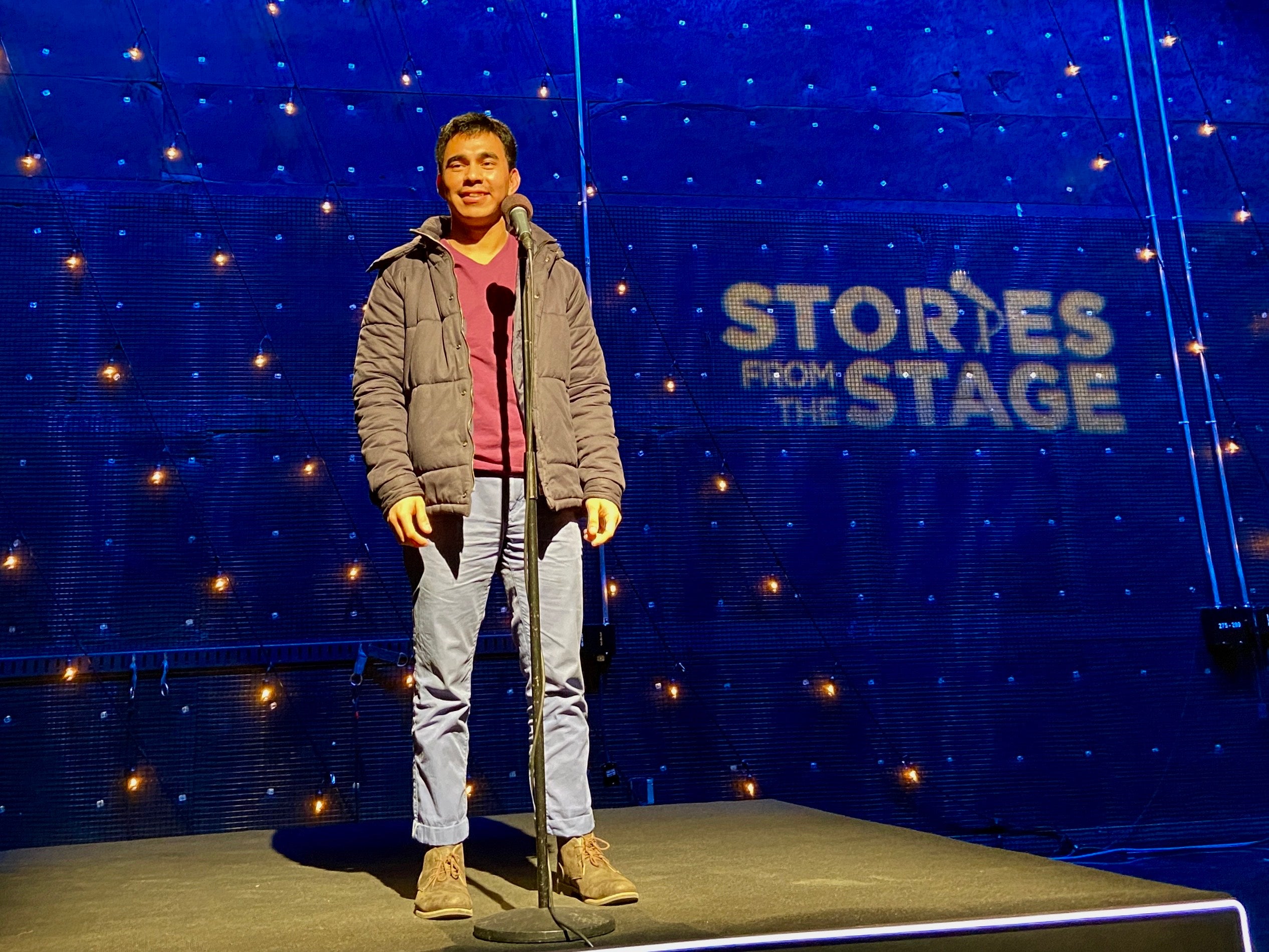 Anthony Azanon standing on stage.