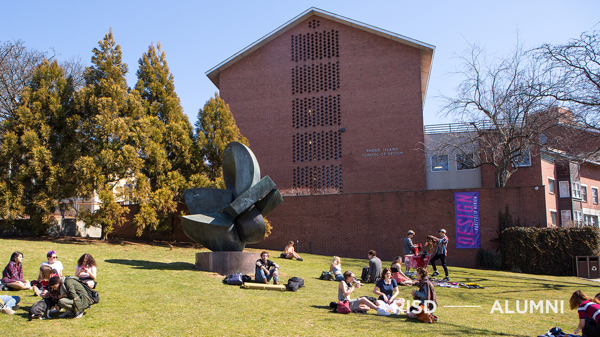 Students on the RISD Beach on a sunny day.