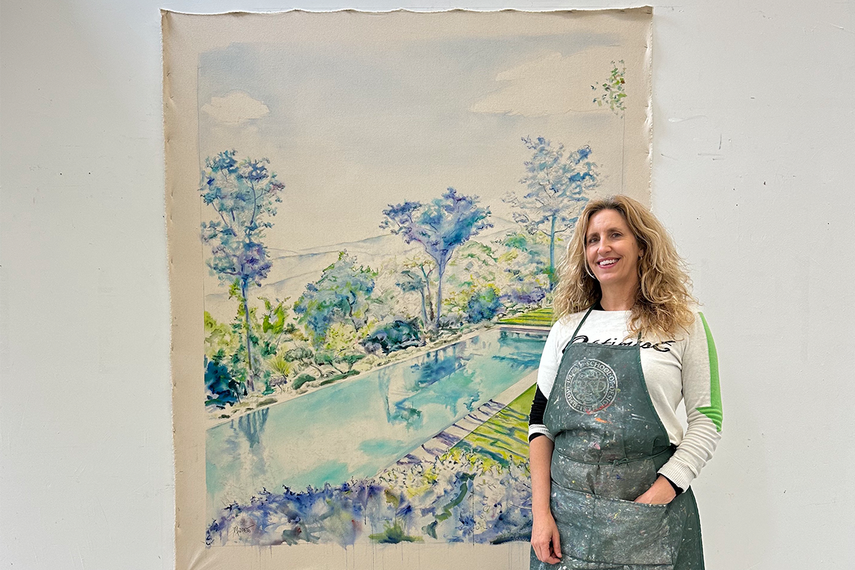Marisa Murrow with her painting of a blue and green poolscape