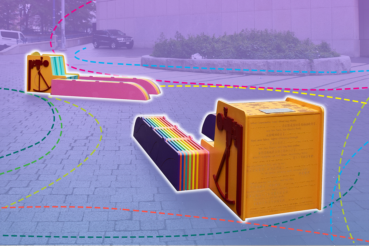Two large sewing machines connected to rainbow-colored platforms