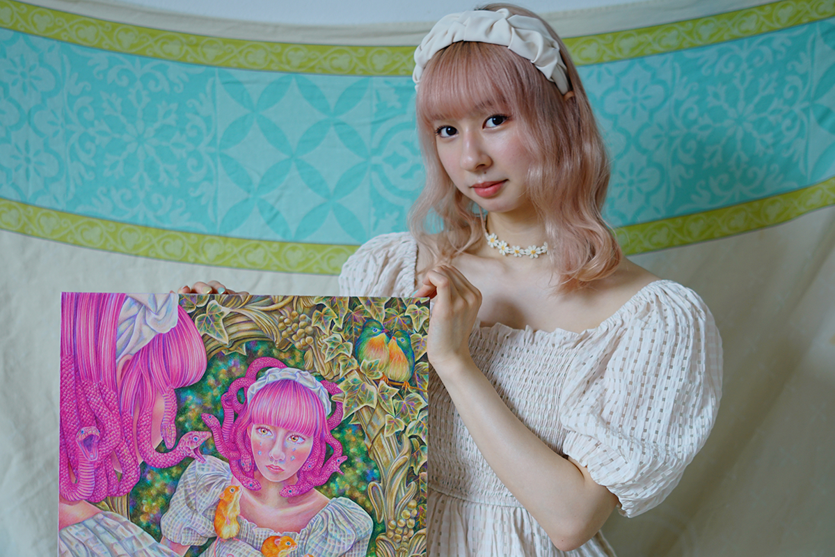 Saki Onoe holding a painting of a woman looking into a mirror