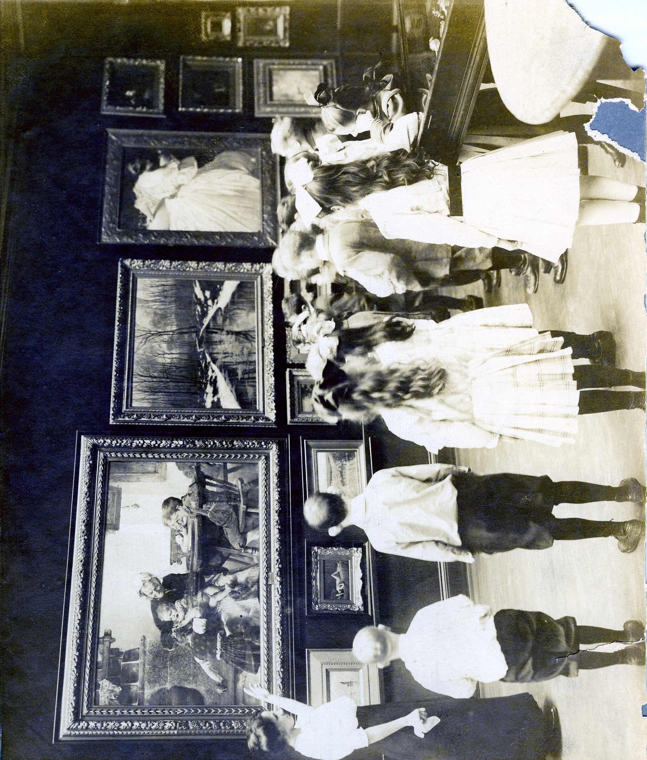 Guided visit, ca. 1915. Staff member may be Margery MacKillop, a museum assistant and educator who was largely responsible for establishing the RISD Museum’s programming for public school students. Courtesy of the RISD Archives.