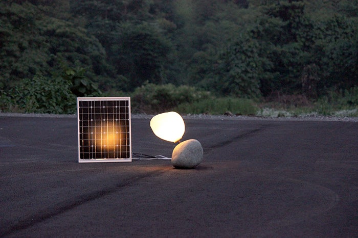 Photo of Sean Salstrom's work, Self Sun which includes a solar panel and light.
