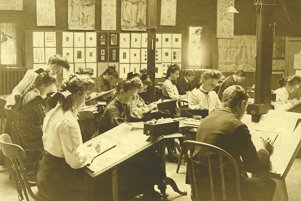 Historic 19th century photo of students in the studio.