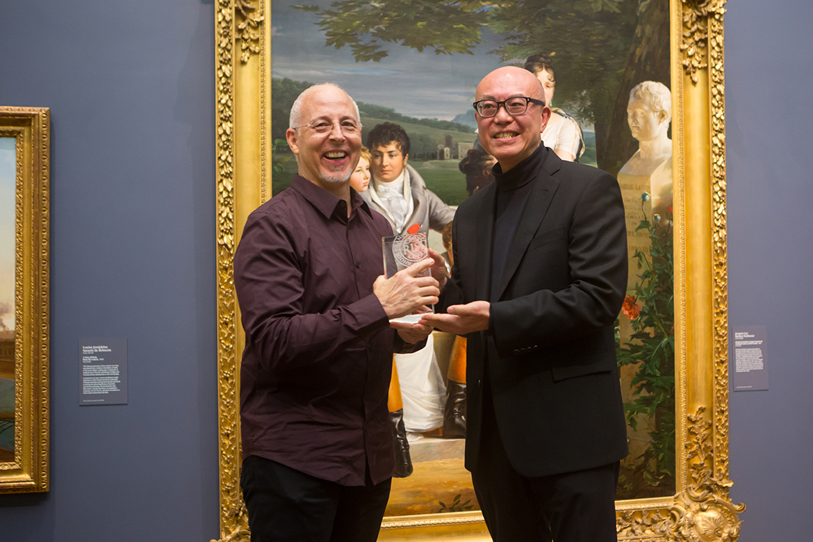 Photo of Todd Bartel receiving his award from Donald Choi