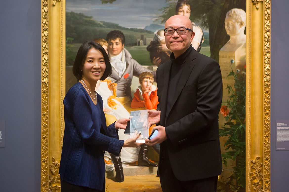 Grace Jun receiving her award from Donald Choi