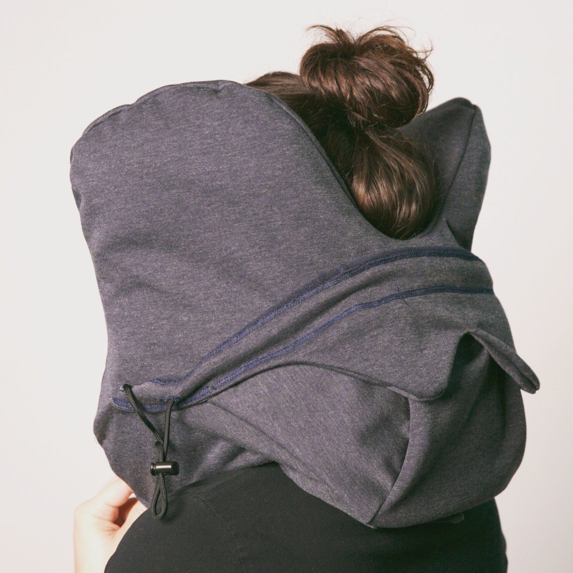 Photo of a person wearing the Harbor Hood, back view