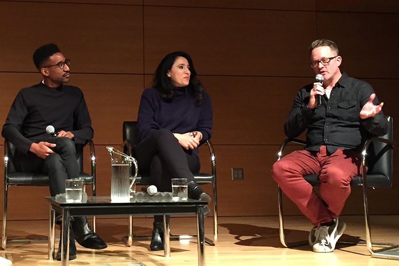 Photo of panelists on the stage.