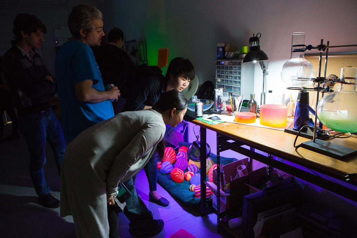 Students observing materials in the studio.
