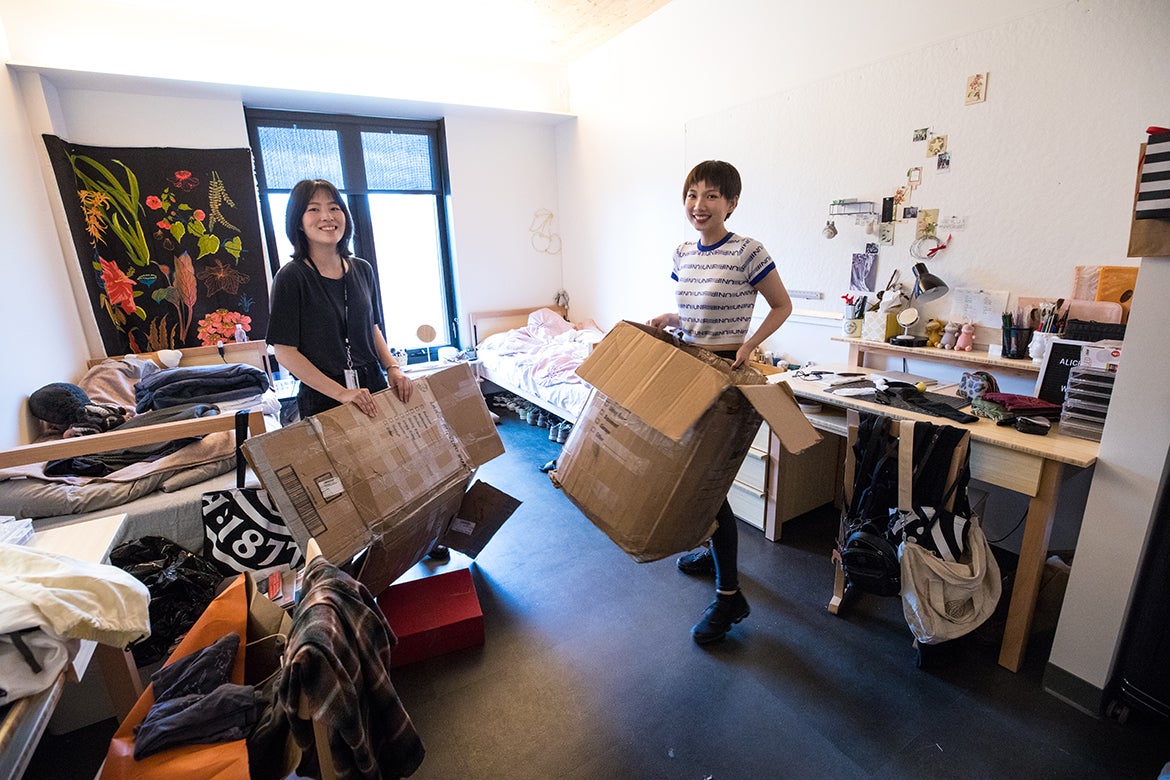 Photo of two students moving into the new dorm