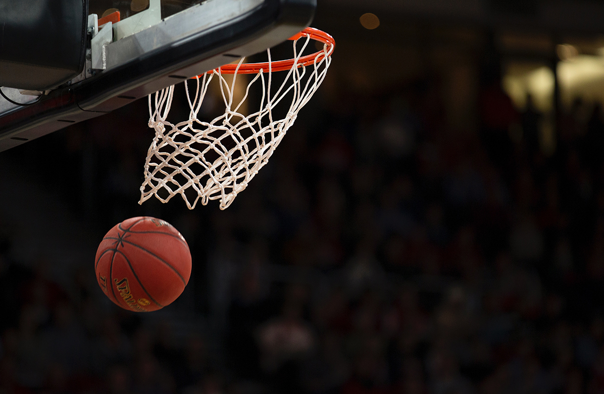 Photo of basketball and hoop.
