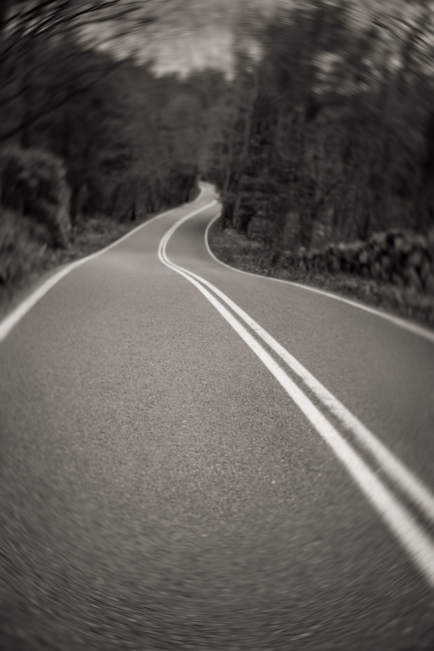 Photo of an empty road with a double yellow line
