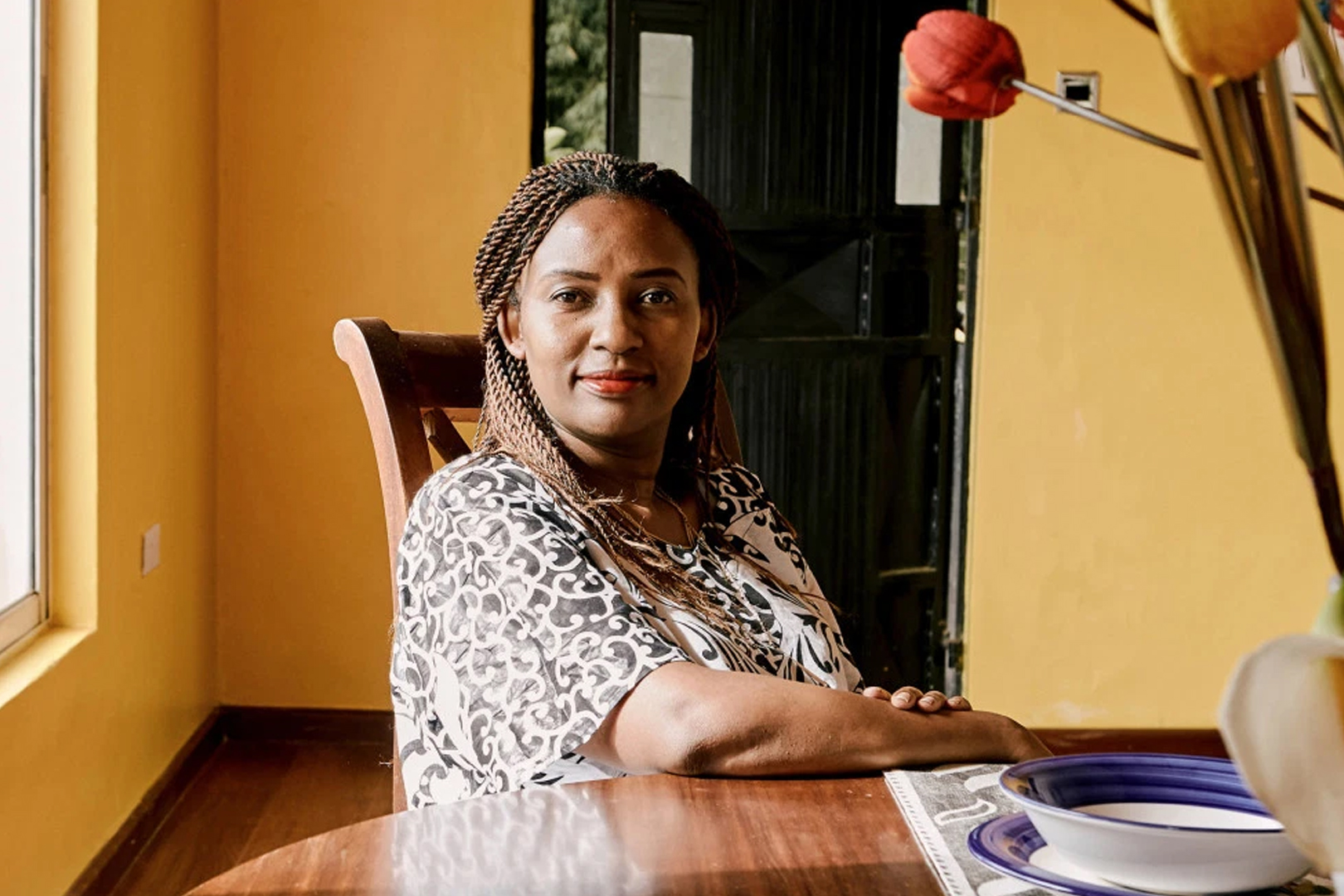 A woman sitting at a table.