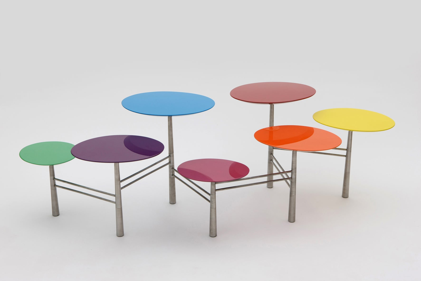 Pebble Table in colored lacquered top and movable brass legs.