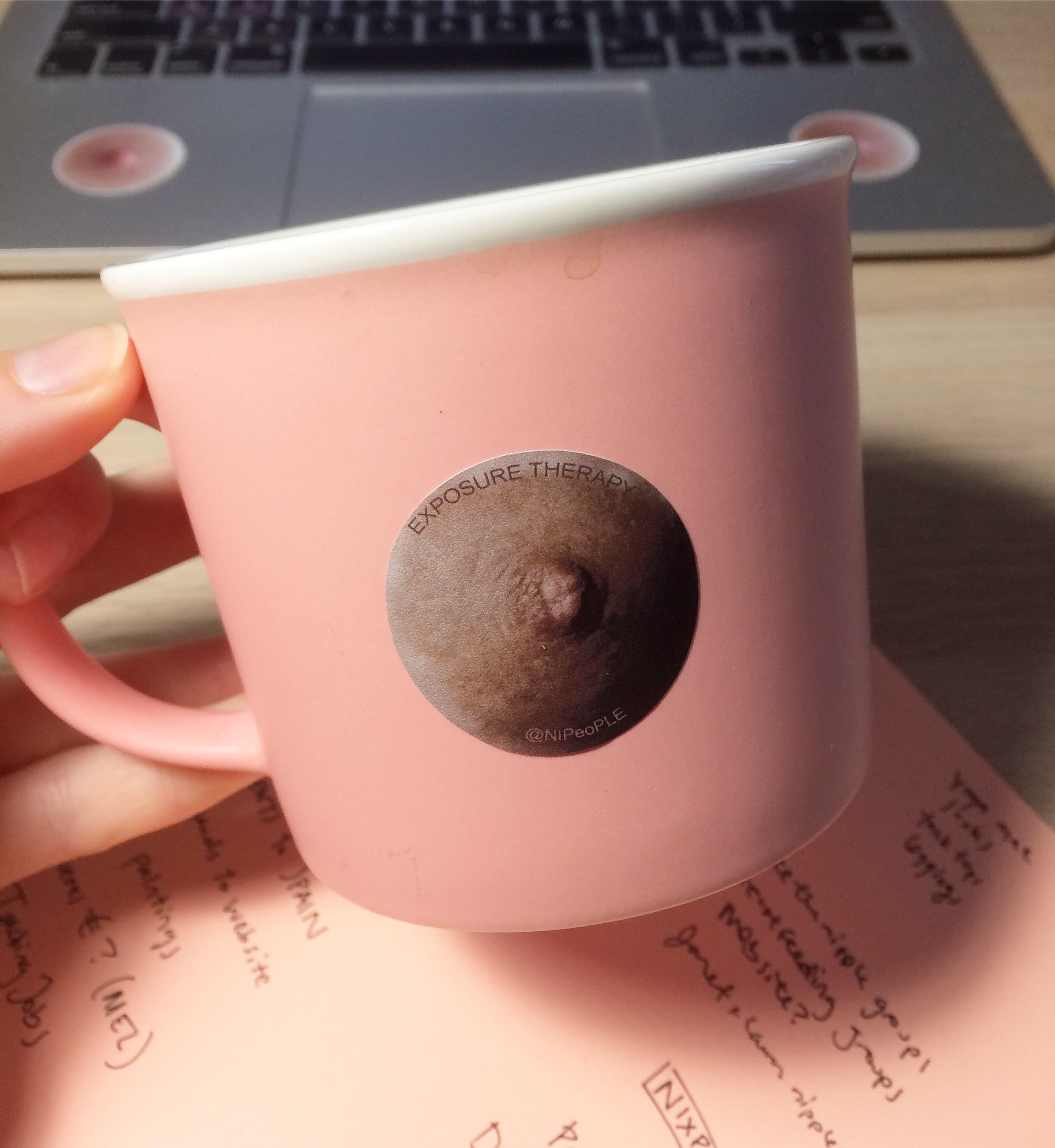 Nipple sticker on a mug.