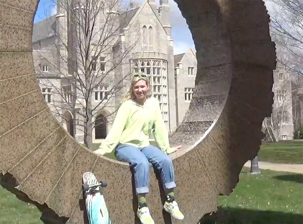 Woman sitting posing for photo.