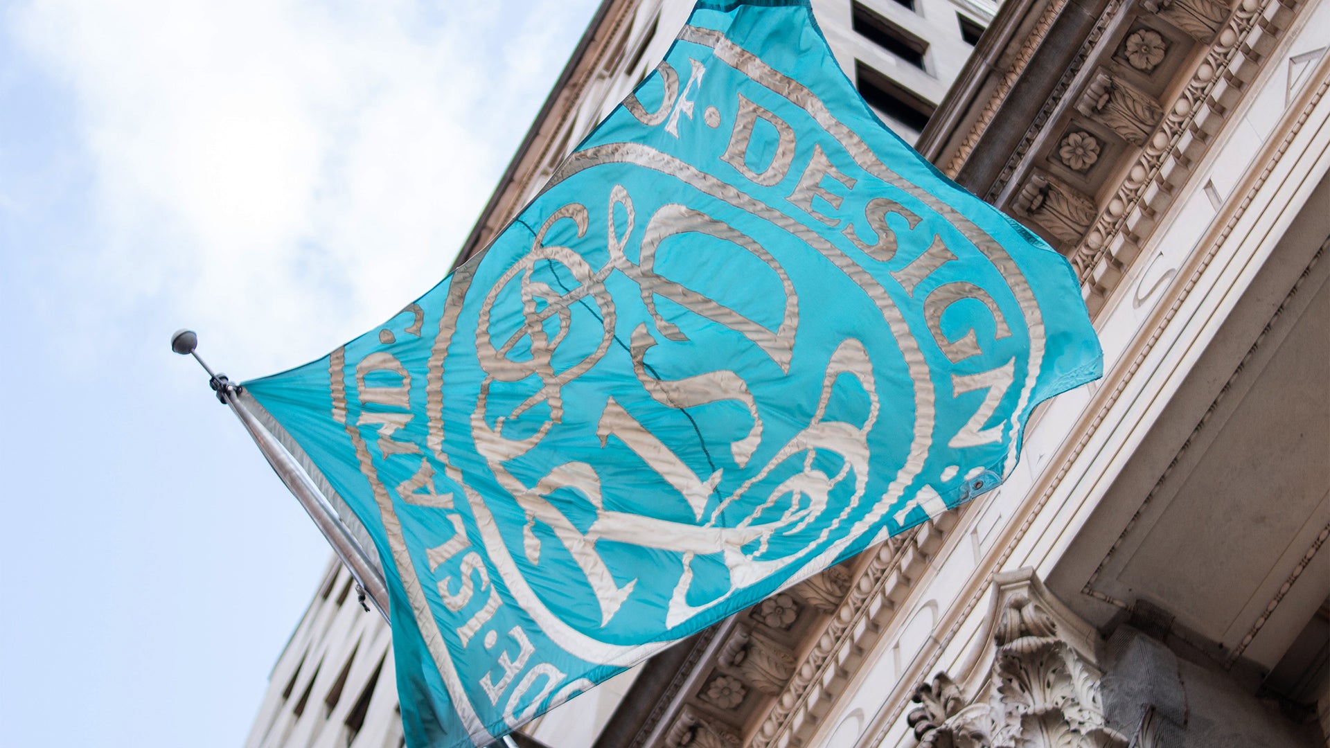 A RISD flag waving in the wind.