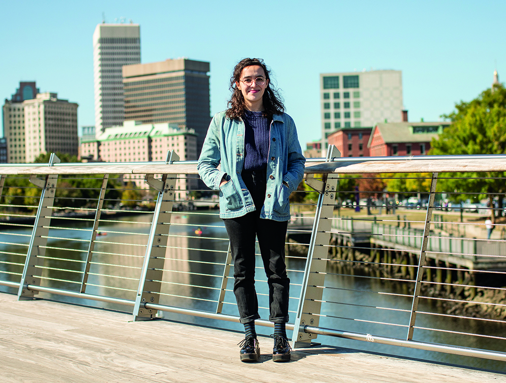 An image of Katrina Machado standing by a river