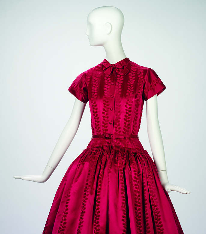 An image of a dressmaker's dummy wearing a red dress