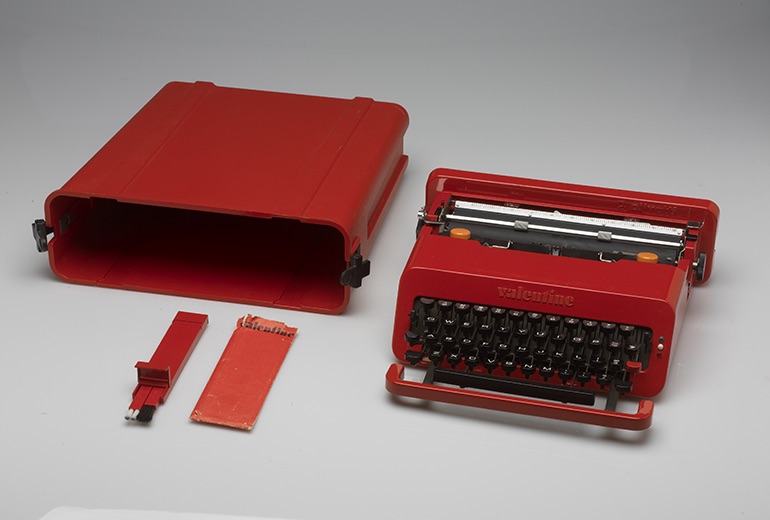 An image of a red typewriter