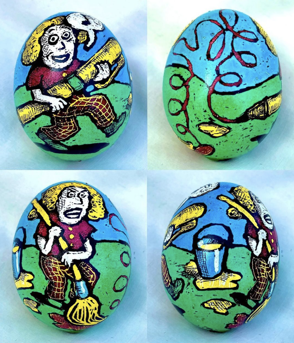 Image of four painted eggs with blue sky green grass and a cartoon-styled blond person 