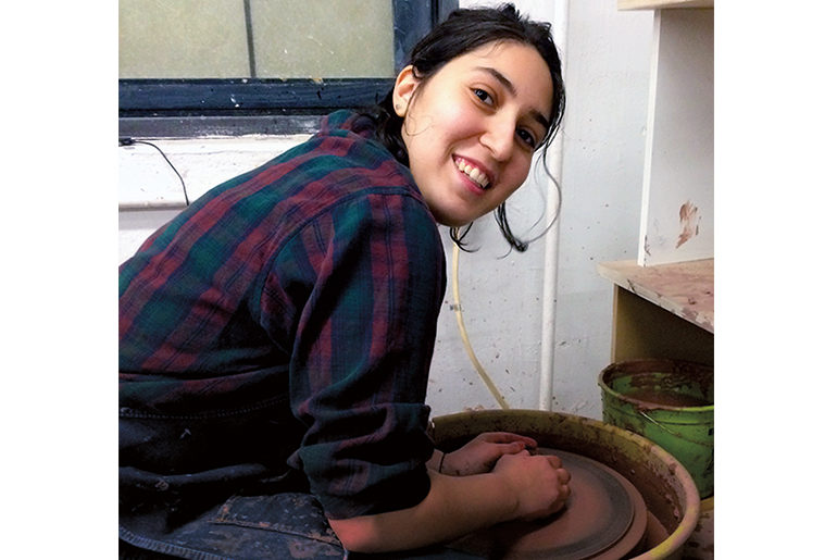 Image of a person at a ceramics wheel