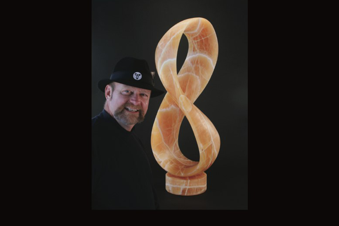 Image of T Barney with one of his mobius sculptures