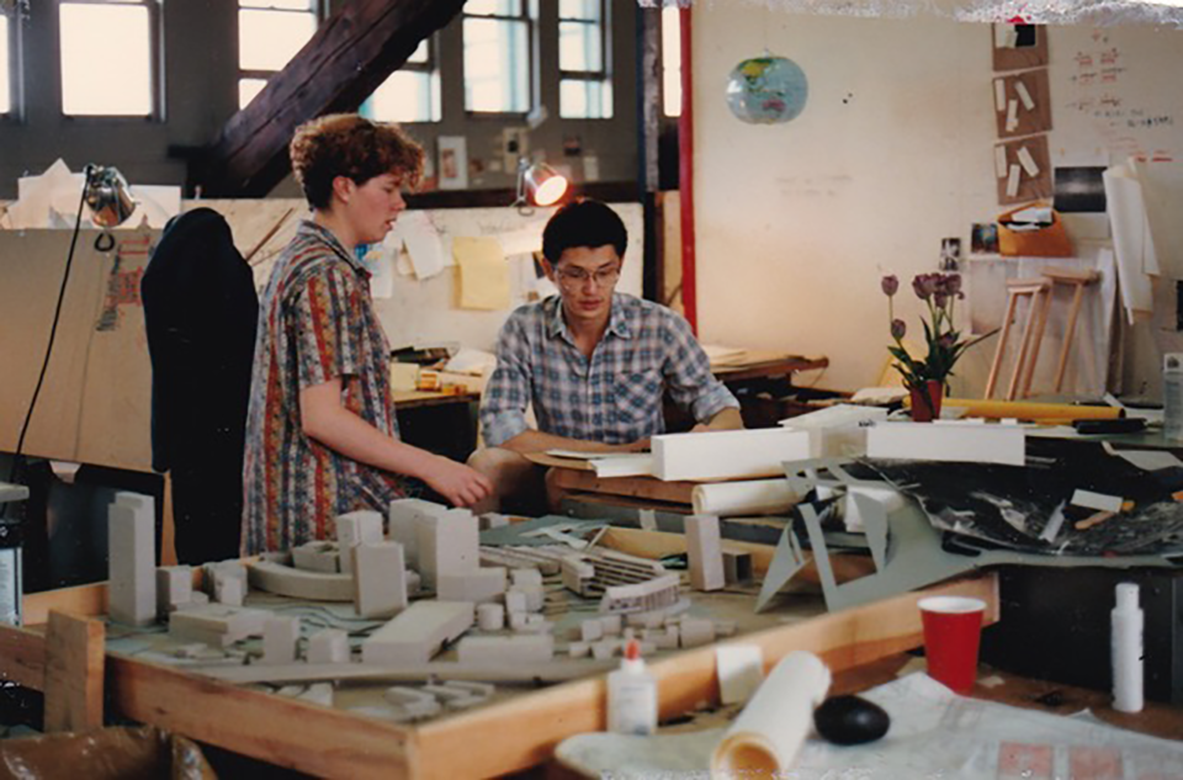Two students with architecture models