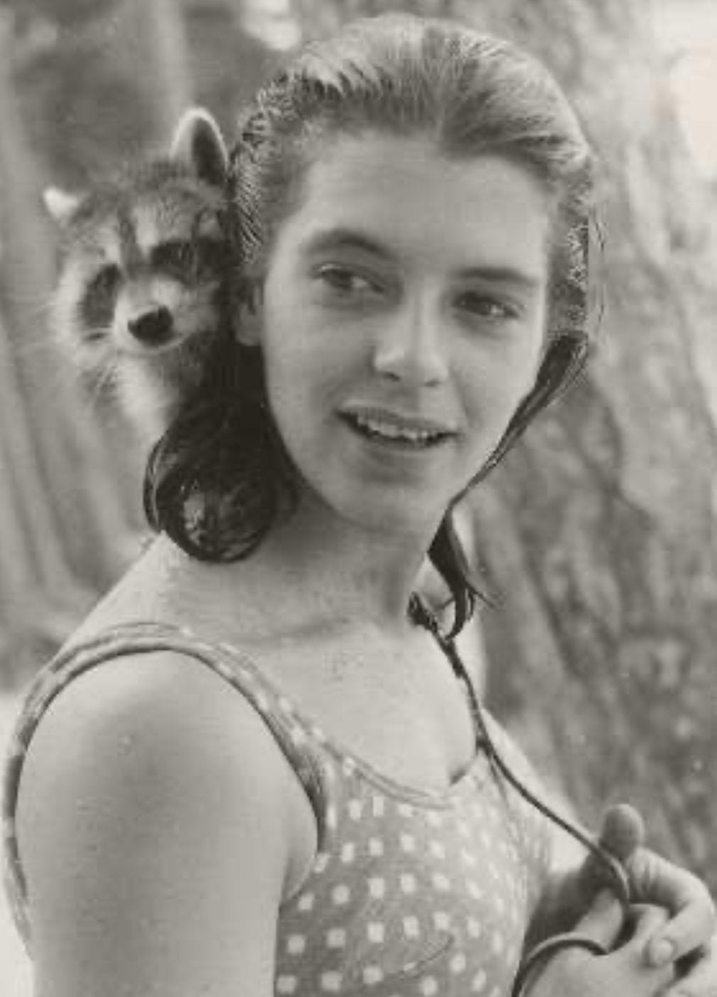 Anne, while a student at RISD, pictured with raccoon Bandit