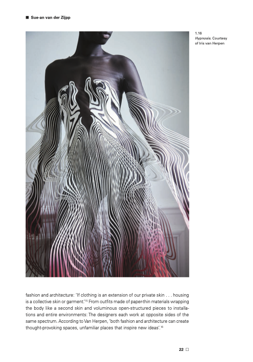 A woman wearing a sculpted silver and pink ombre dress