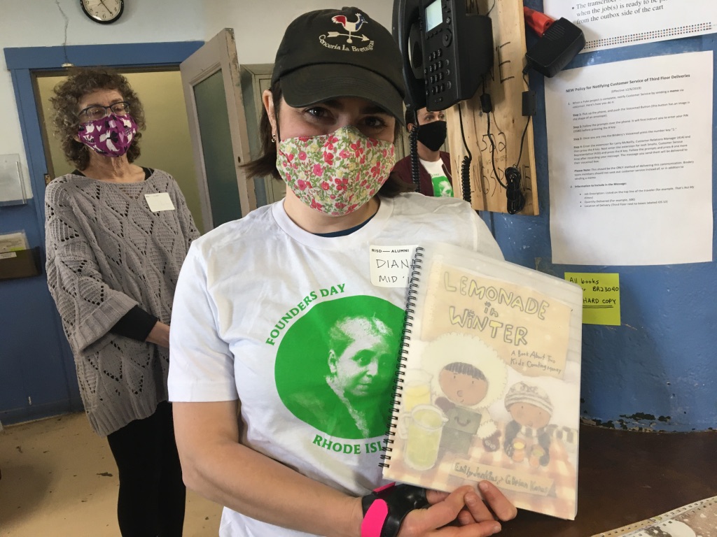 A person holding a children's book