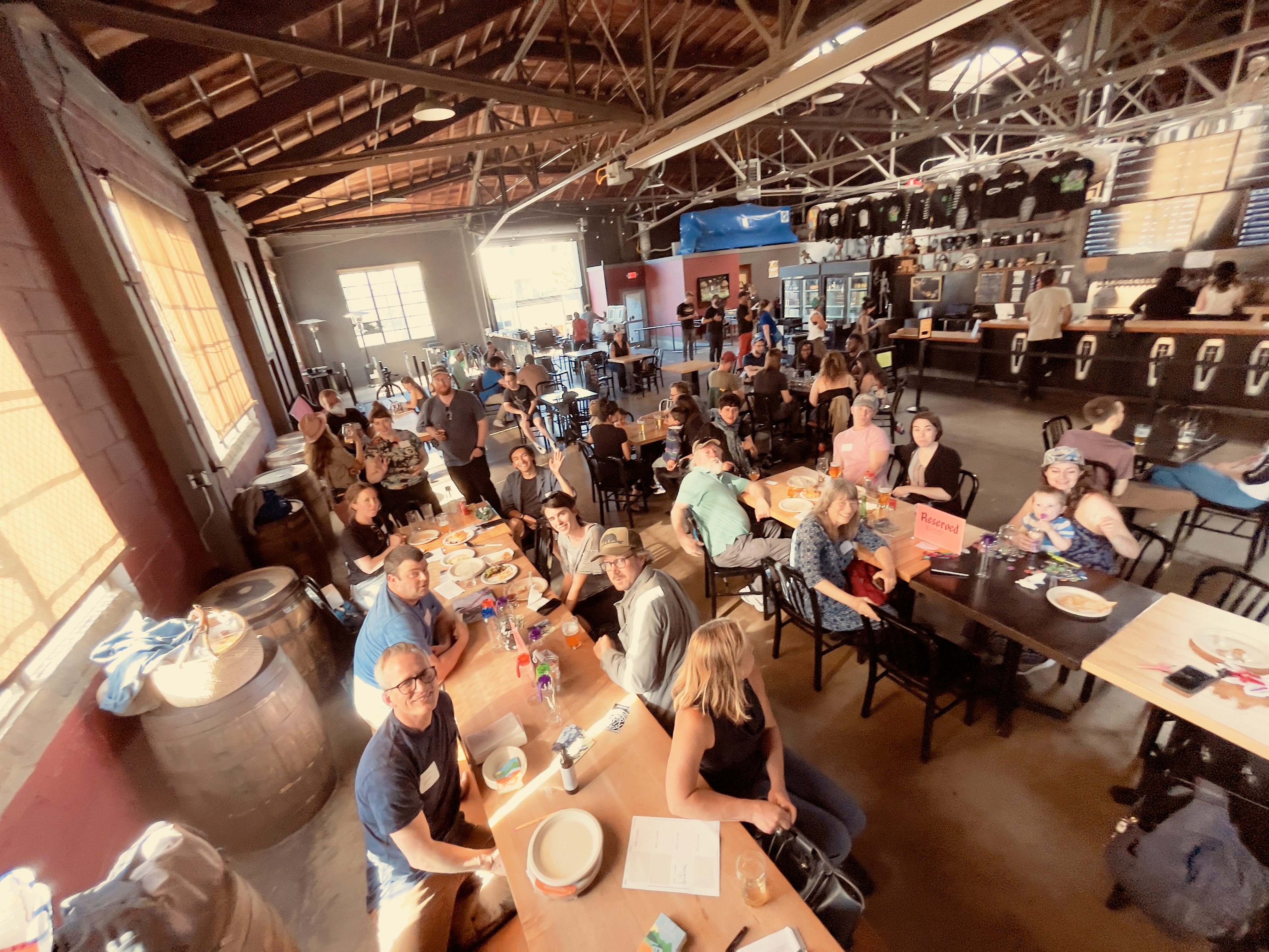 A crowd of people in a brewery restaurant
