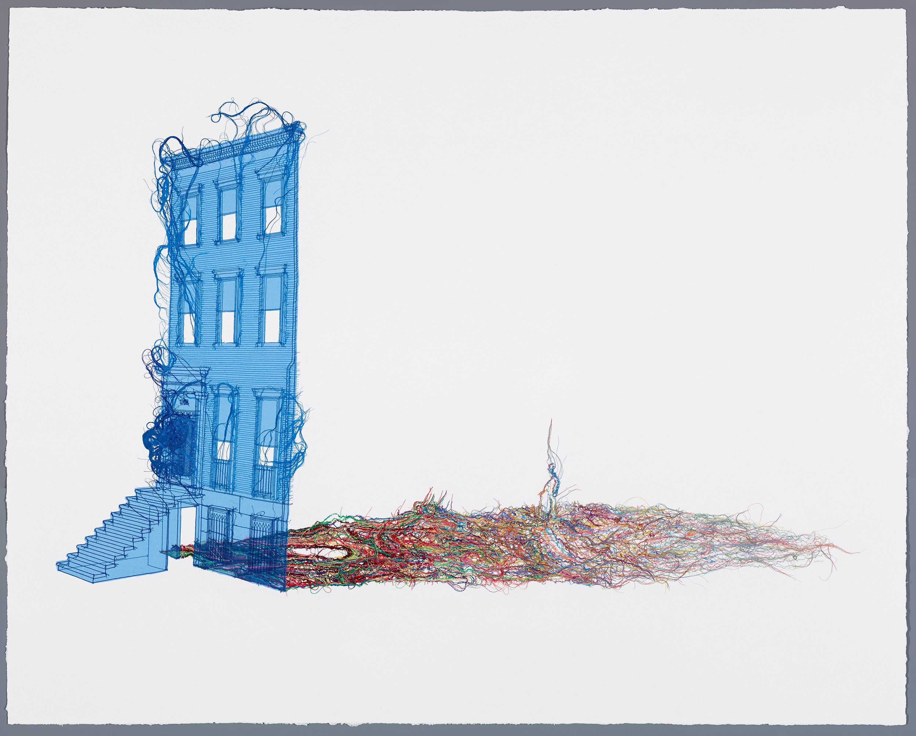 A façade of a three-story house made of blue thread beside a heap of multicolored thread