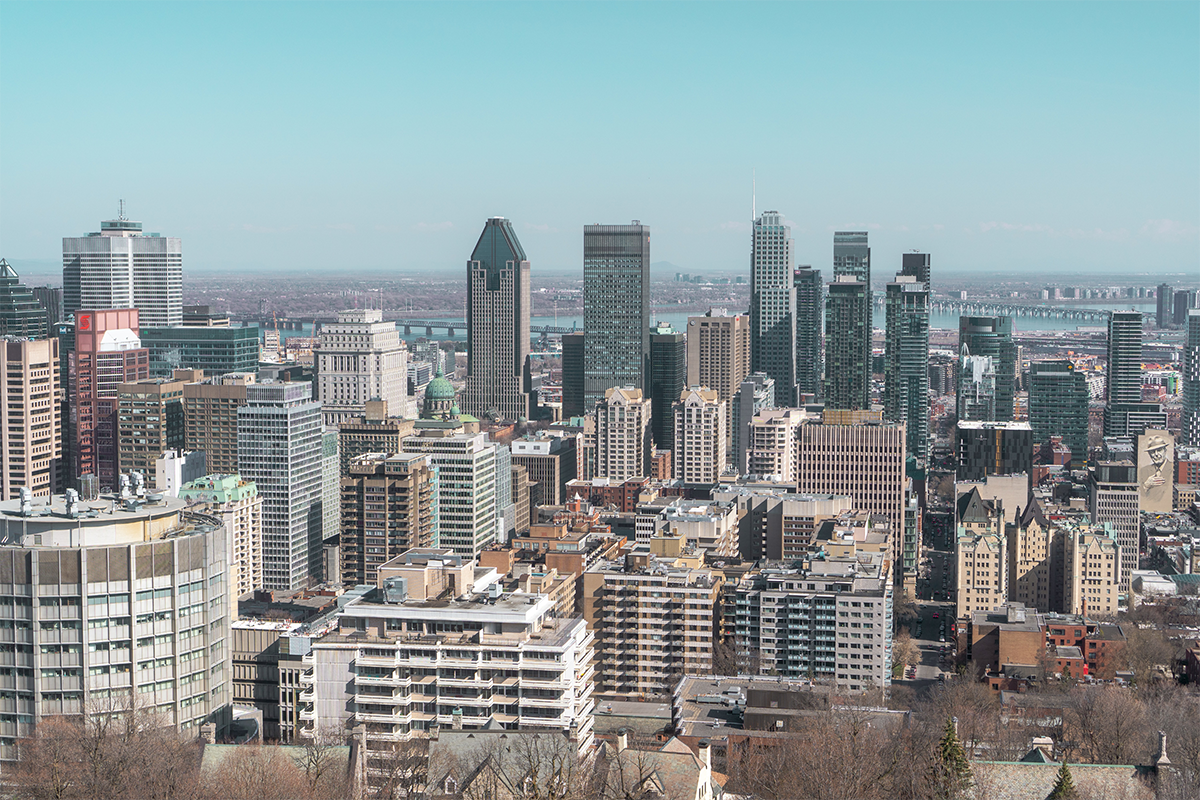 Montreal skyline under blue sky in daytime