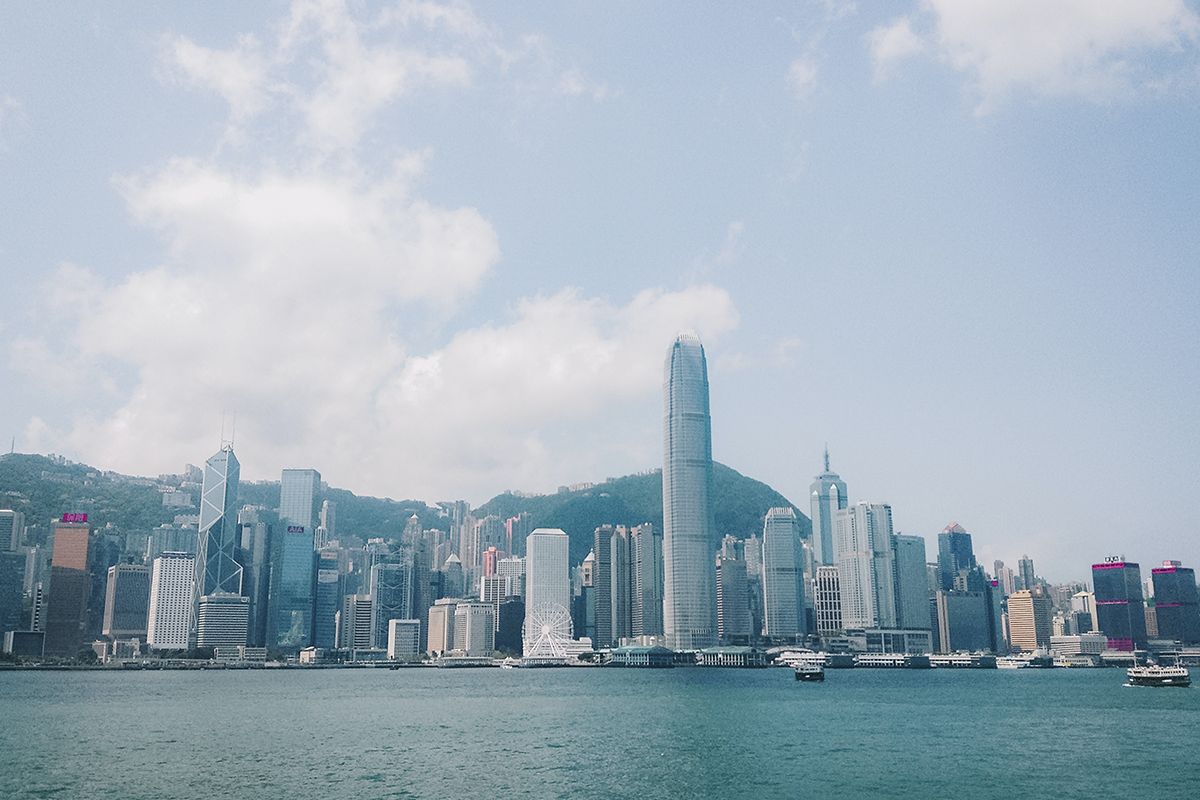 Hong Kong skyline across water during daytime