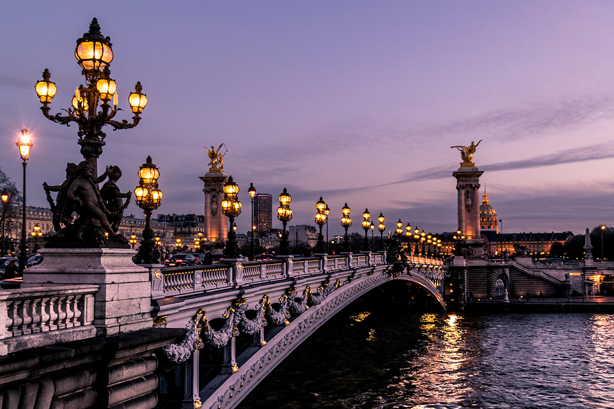 A bridge in Paris during the night time