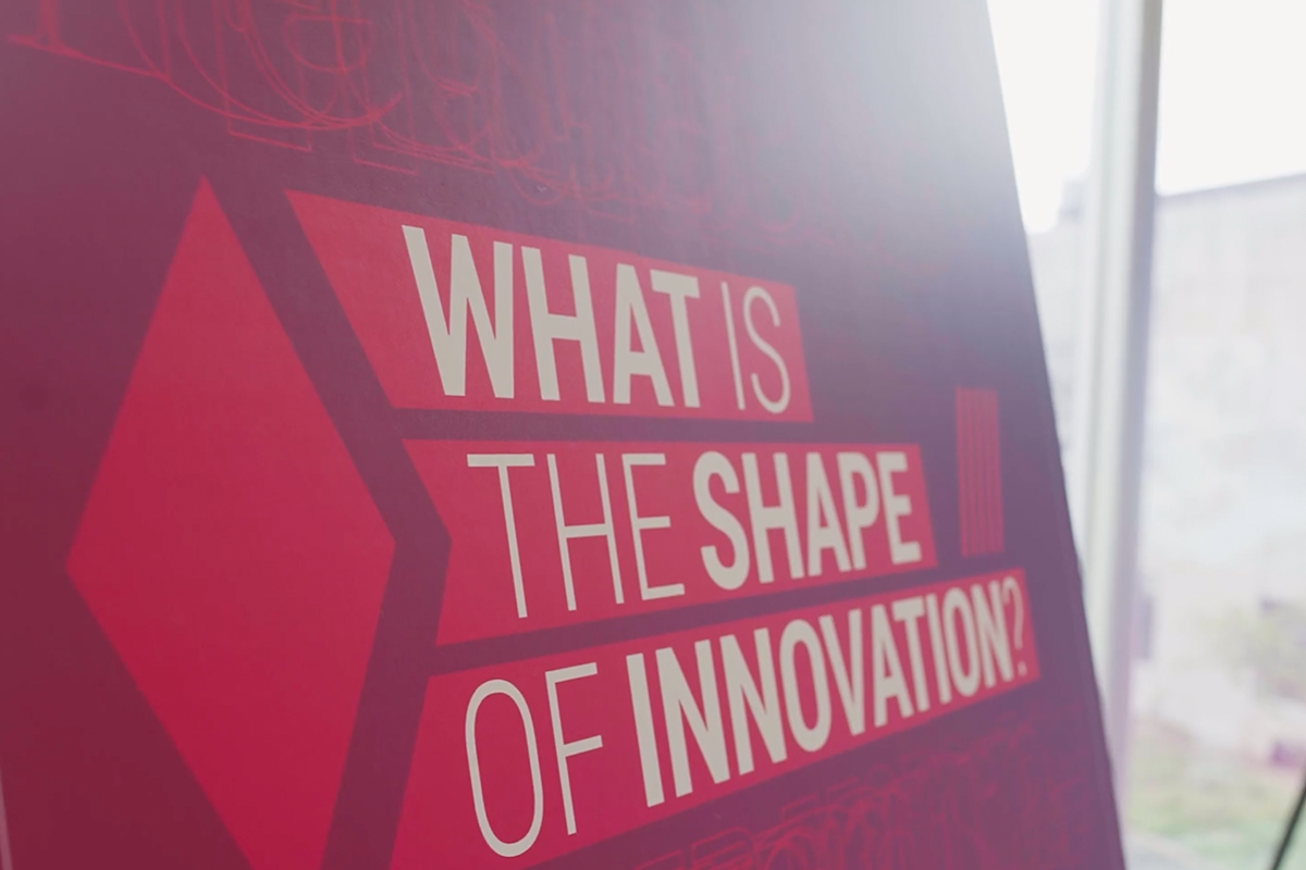 A placard that reads "What is the Shape of Innovation?"