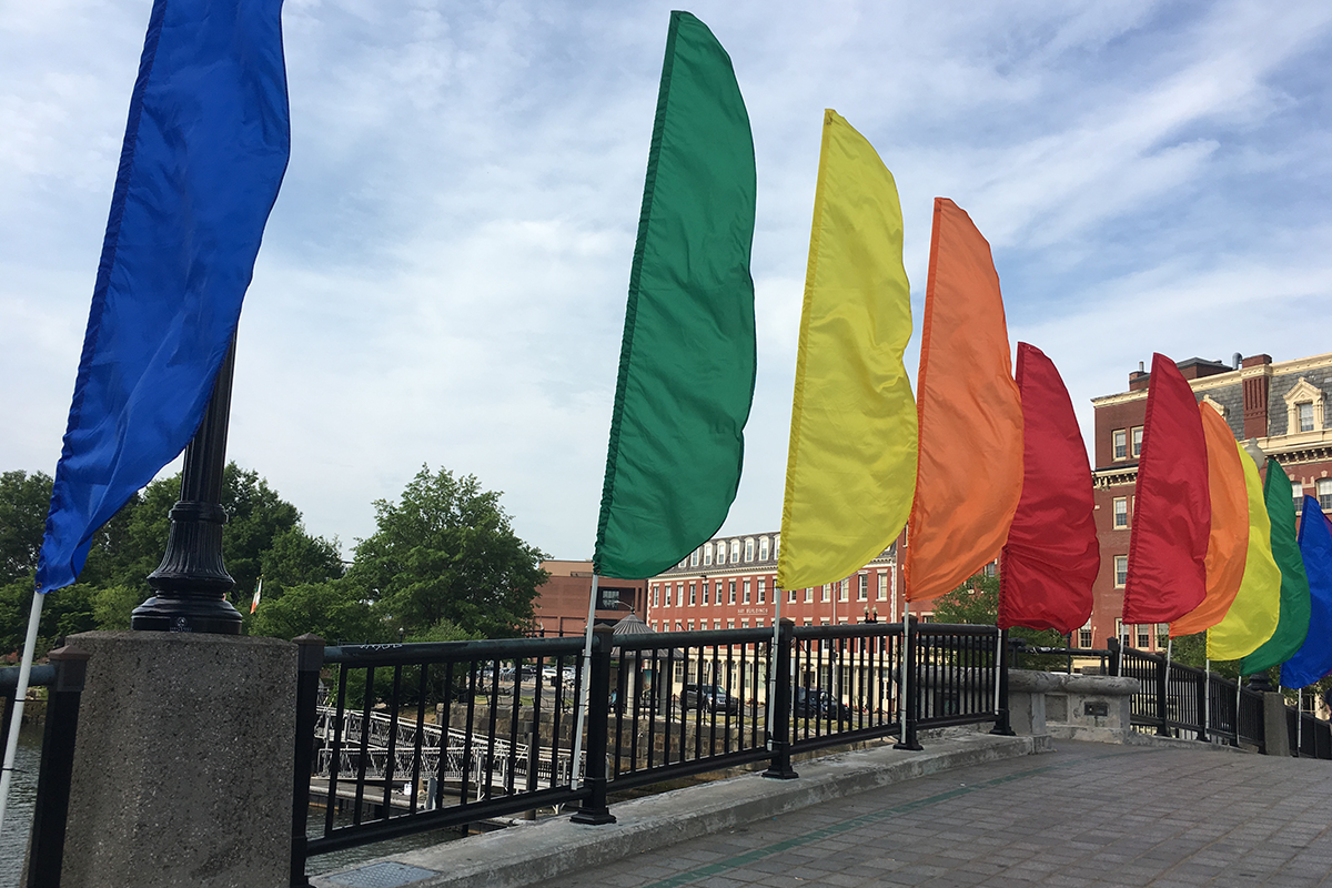 Rainbow flags over a bridge