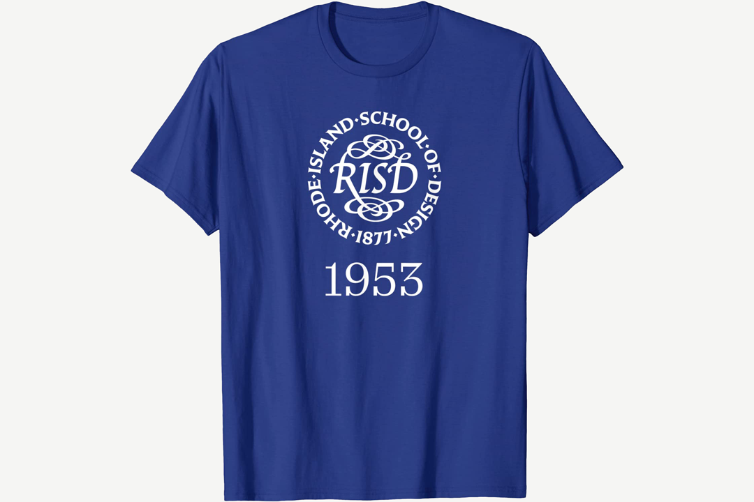 Blue T-shirt with a white seal and text 1953. Seal reads RISD in the center with Rhode Island School of Design 1877 surrounding it