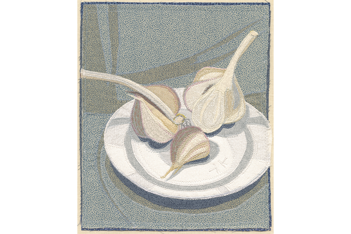 A work of thread that depicts three bulbs of garlic on a plate