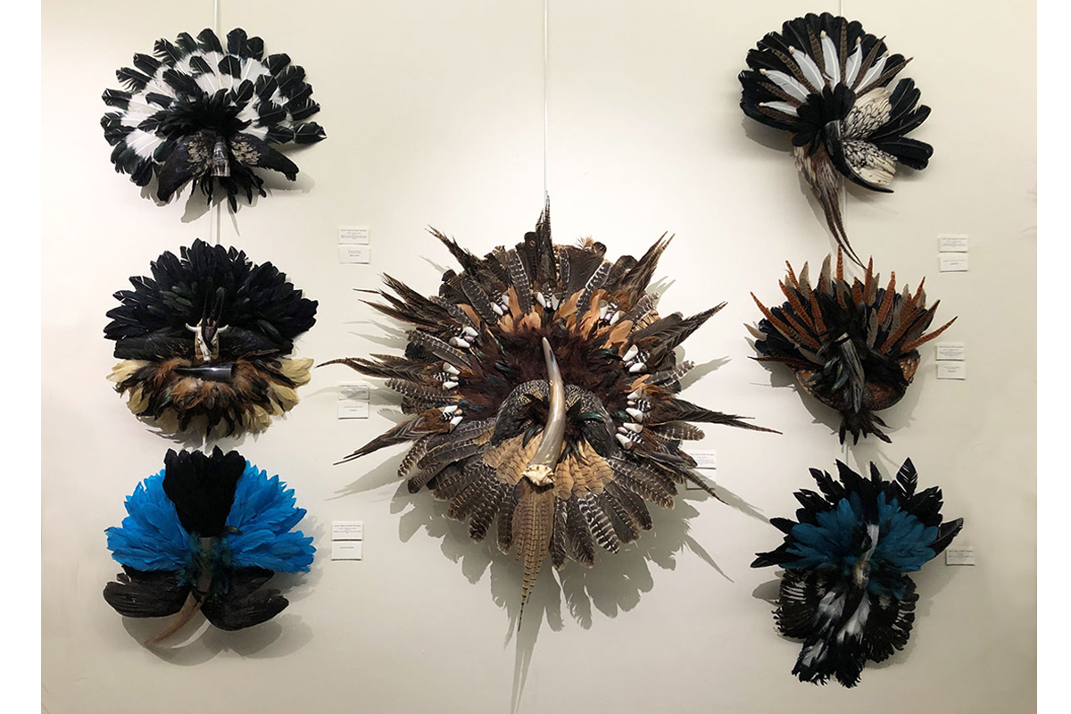 Seven works of feathers and other materials from the "In Flight" exhibition