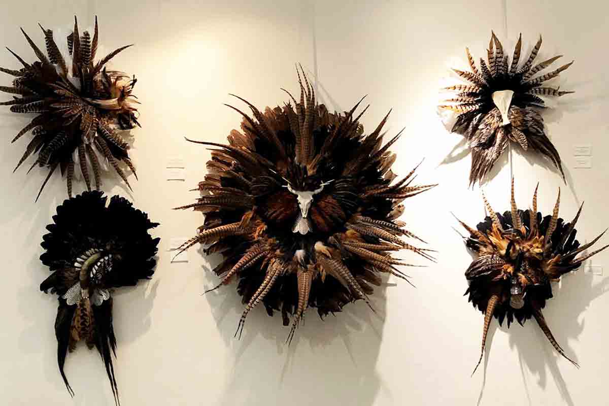 Five works made of feathers and other materials by Cynthia Ross Meeks
