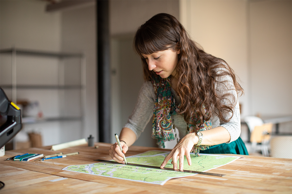 Student working on a drafting table 