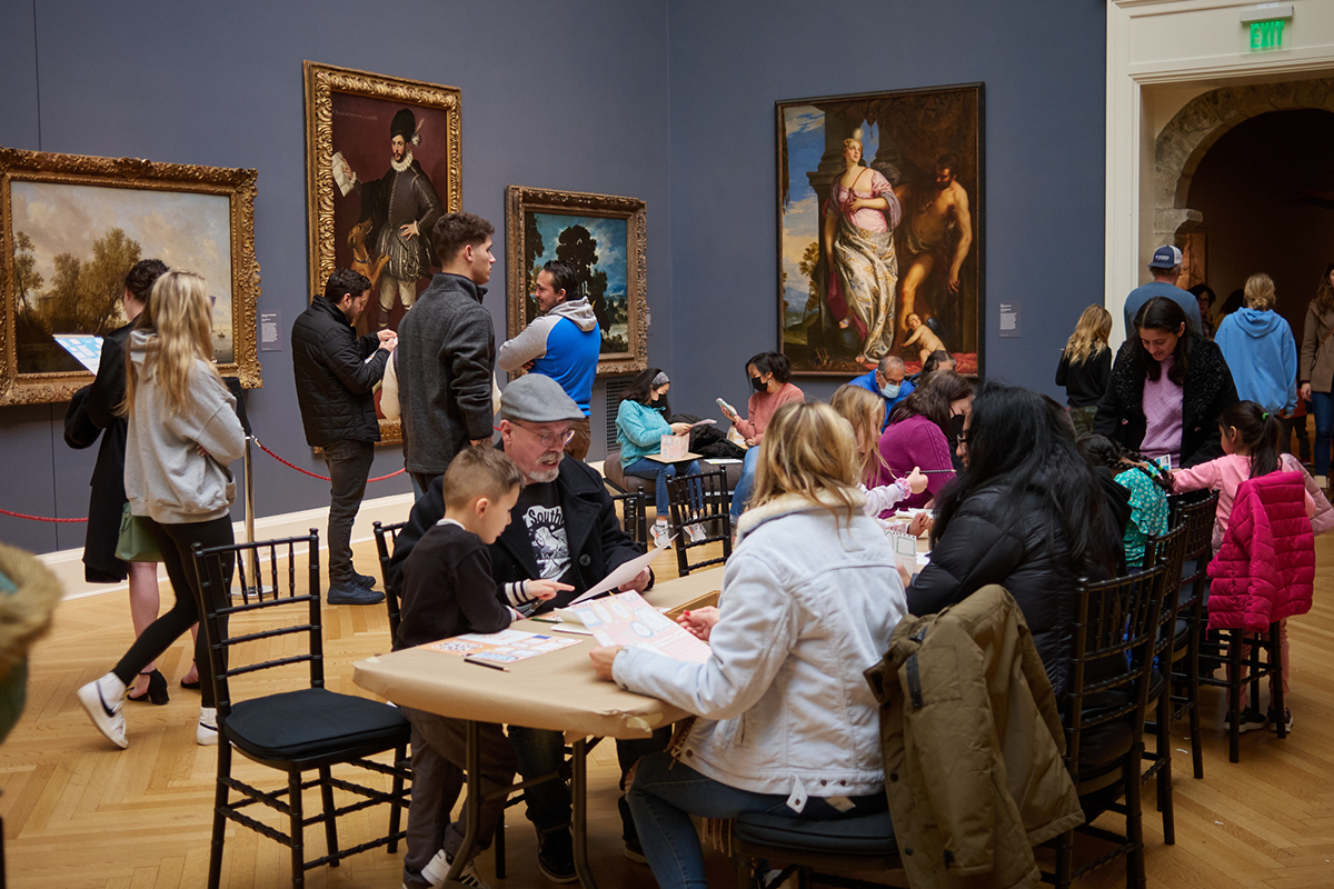 Image of adults and children in the grand gallery of the RISD Museum 