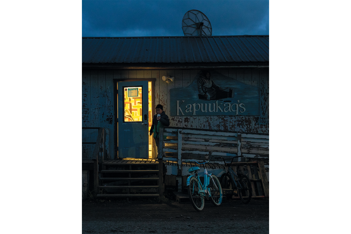 A boy exits a convenience store in Unalakleet, Alaska, an Alaska Native village of about 760 people on the coast of the Bering Sea. The nearby city of Nome, a hub for Unalakleet and other small villages on the Seward Peninsula, is set to become the first Arctic deepwater port in the United States.