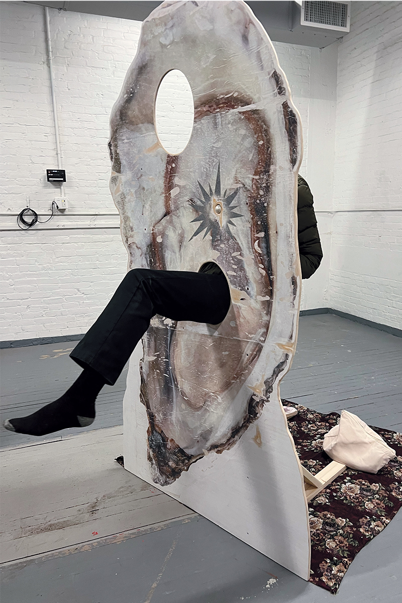 Josa Sabater Grajales interacts with sophomore Ryan Huang’s giant oyster sculpture exploring themes of exteriority/interiority, eroticism, and our public/private selves